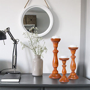 close-up of polished finish and wood grain on candleholders
