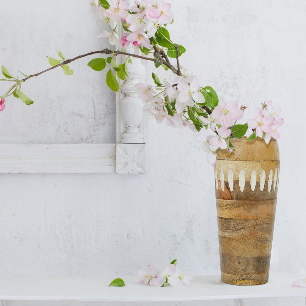Close-up of natural wood grain and rustic finish on mangowood vase