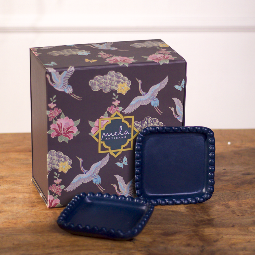 Close-up of beaded edge design and indigo finish on handcrafted terracotta tray