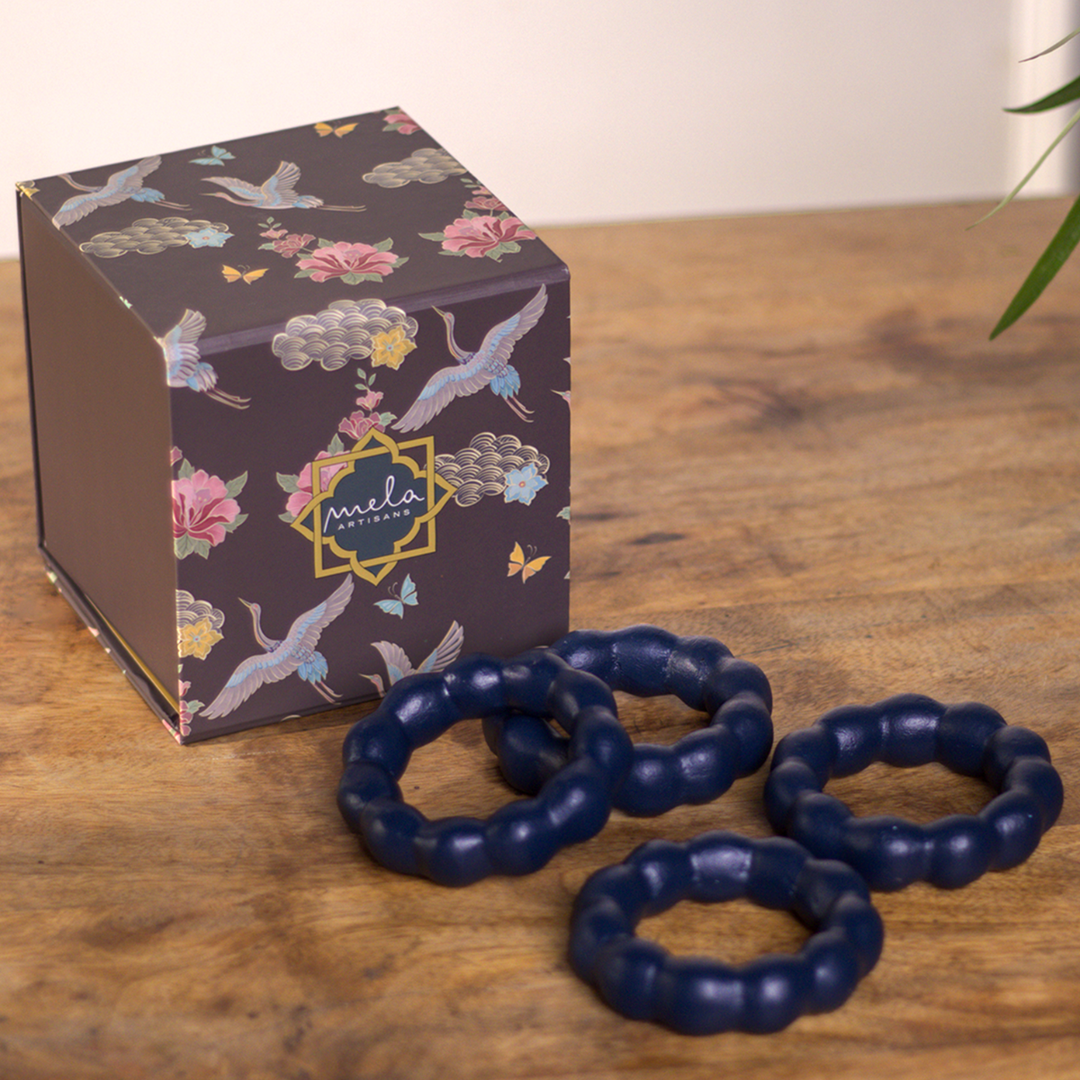 Close-up of handcrafted beaded detailing on terracotta napkin ring