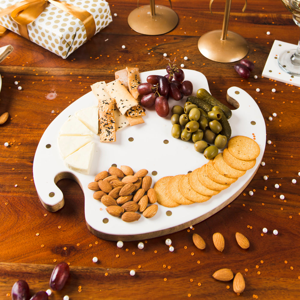 Serving board styled with snacks and table décor