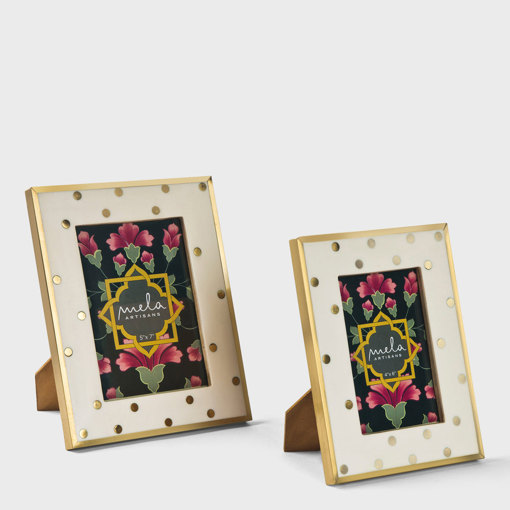 Close-up of brass inlay on ivory resin surface
