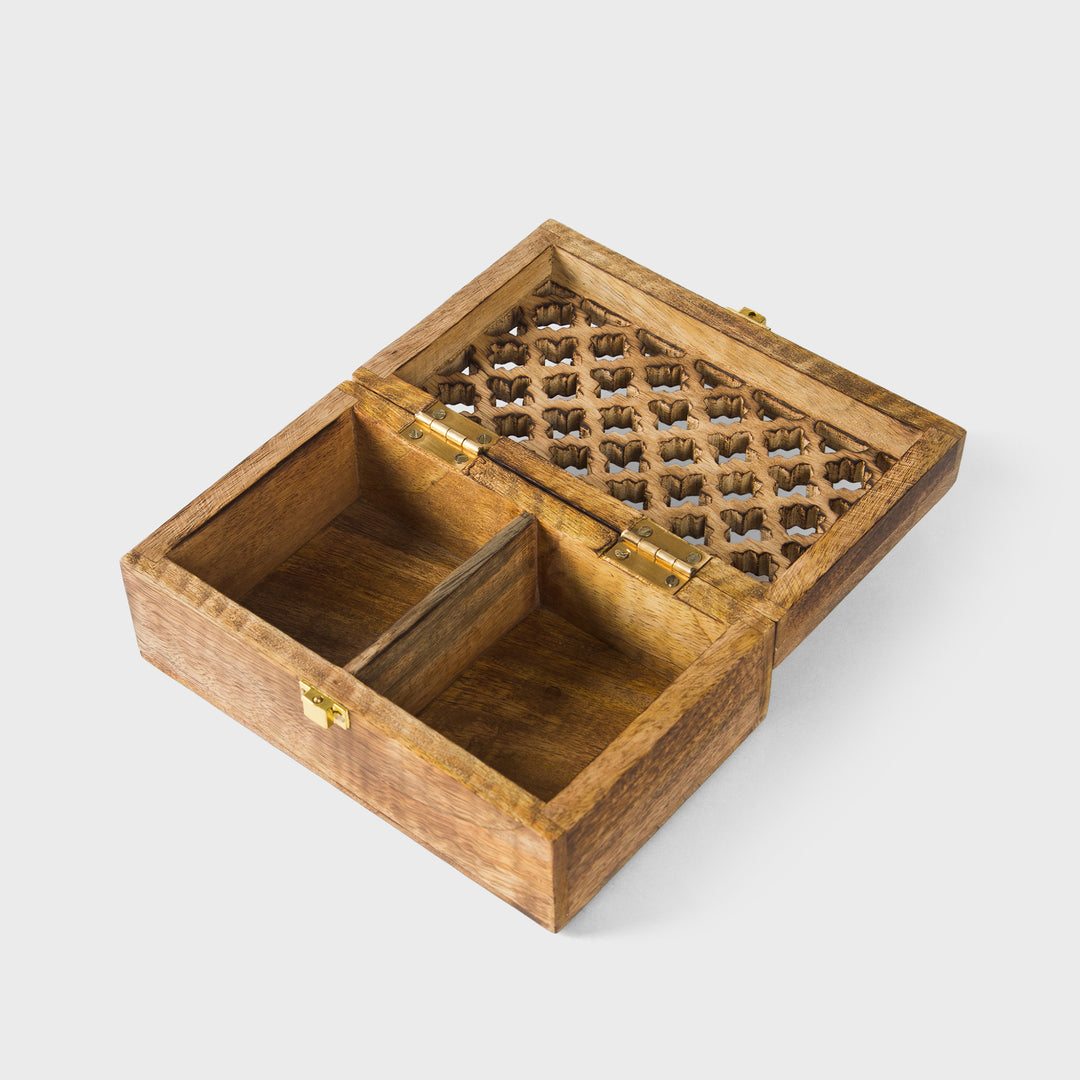 close-up of geometric trellis carving and medium burnt finish on mango wood keepsake box