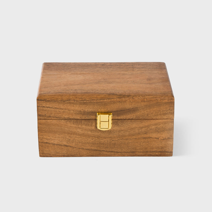 close-up of natural acacia wood grain and latch on handcrafted keepsake box
