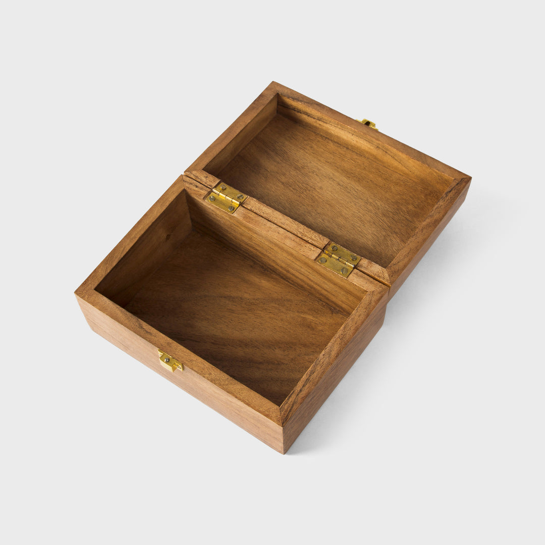 close-up of natural acacia wood grain and latch on handcrafted keepsake box
