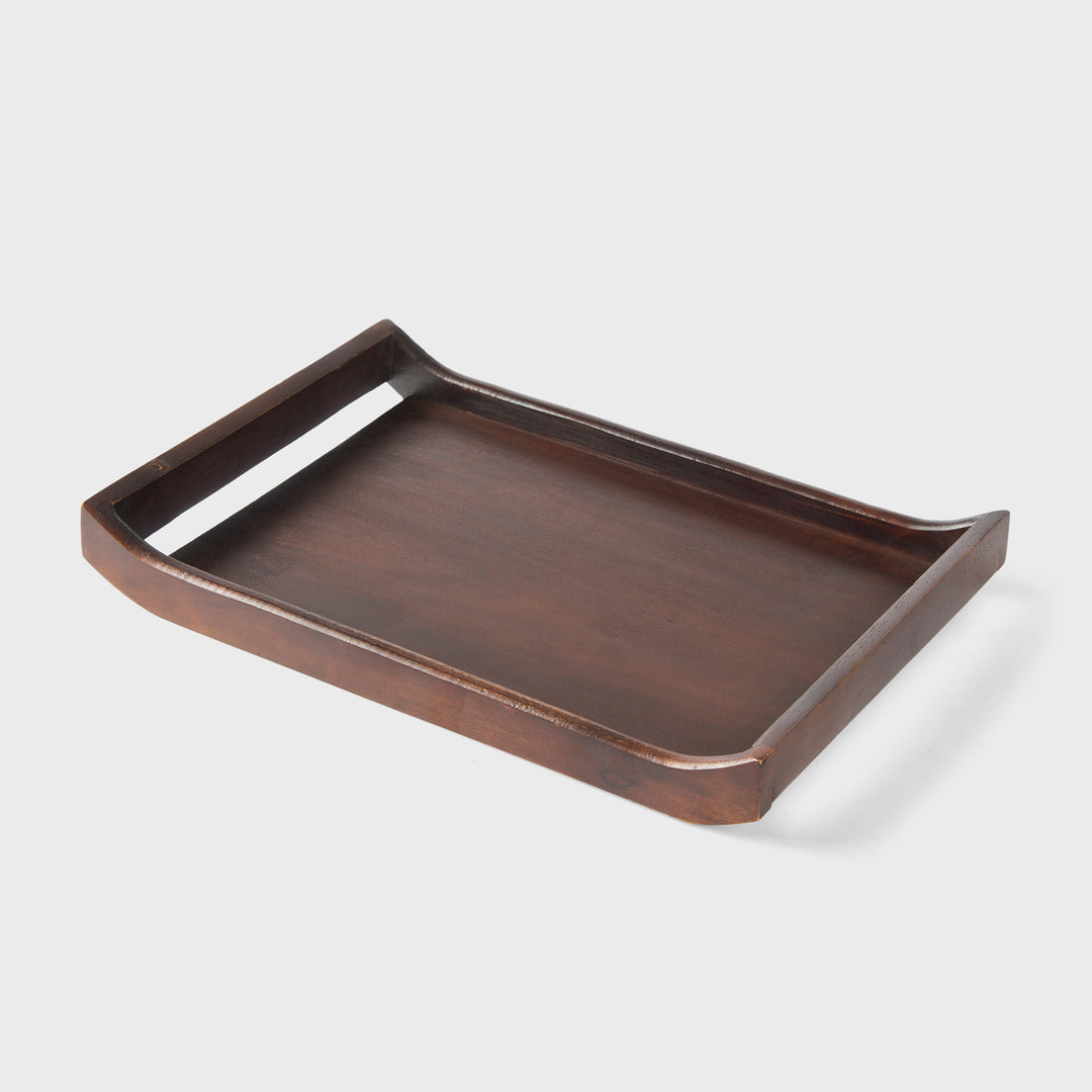 Close-up of urban walnut acacia wood grain and curved handle design on serving tray