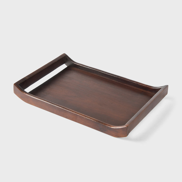 Close-up of urban walnut acacia wood grain and curved handle design on serving tray