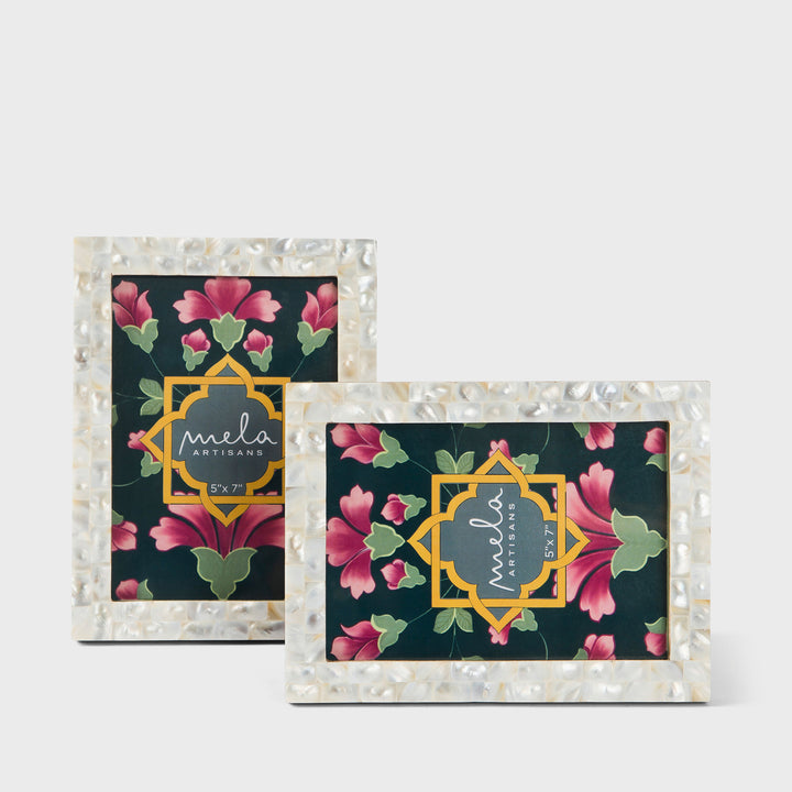 Set of two handcrafted mother of pearl inlay photo frames in white and silver holding 5x7 photos