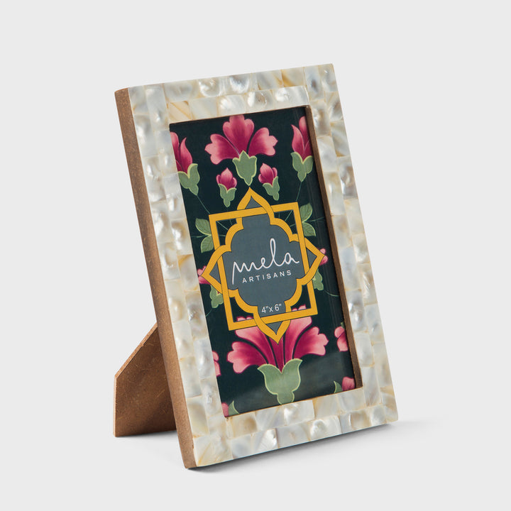 handcrafted mother of pearl inlay photo frames in white and silver holding 4x6 photos