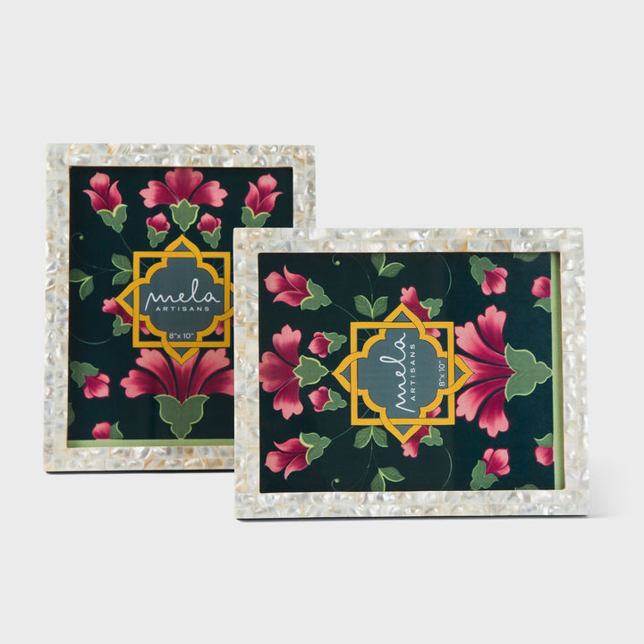Set of two handcrafted mother of pearl inlay photo frames in white and silver holding 8x10 photos