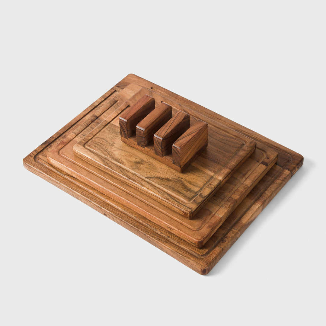 close-up of natural acacia wood grain on handcrafted cutting boards with storage stand