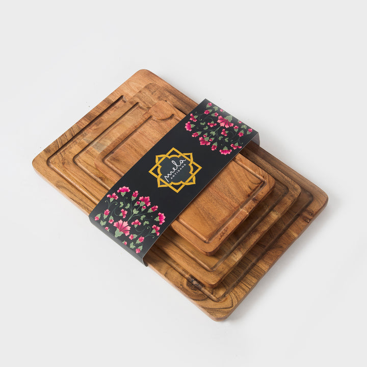 close-up of natural acacia wood grain on handcrafted cutting boards set

