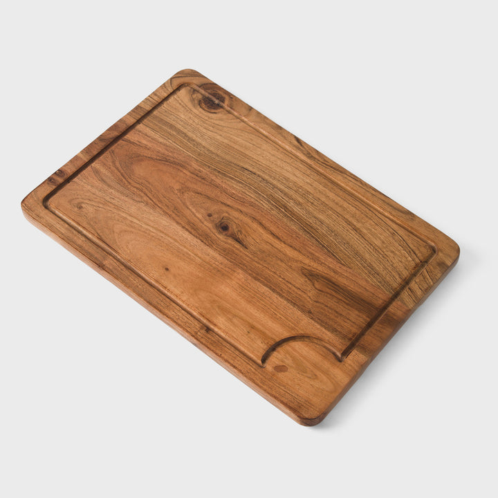 close-up of natural acacia wood grain on handcrafted cutting boards set
