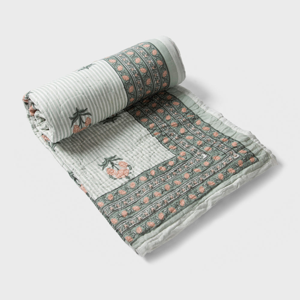  reversible cotton quilt in green  with floral and geometric patterns