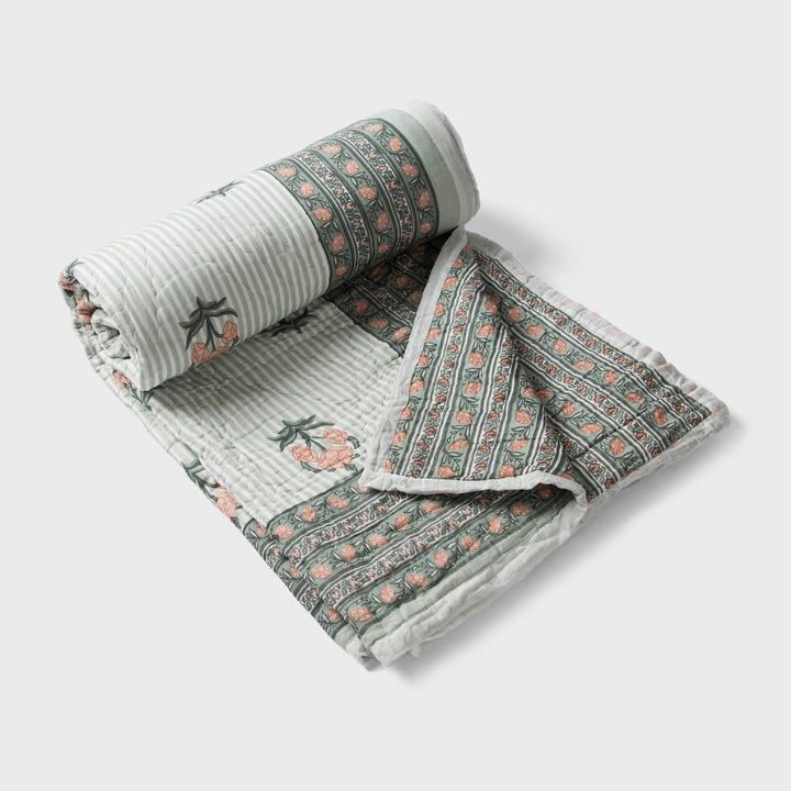  reversible cotton quilt in green  with floral and geometric patterns