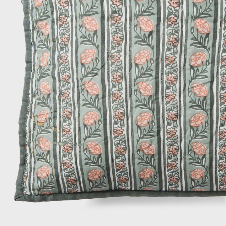 Close-up of green block printed pattern and cotton fabric texture