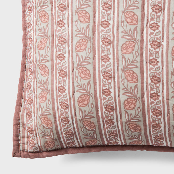 Close-up of blush pink block printed pattern and cotton fabric texture