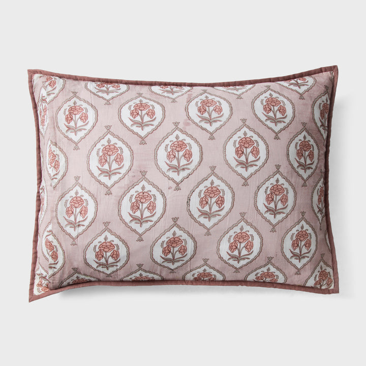 Close-up of blush pink standard printed pattern and cotton fabric texture