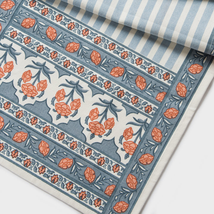Printed cotton table runner in blue floral stripes
