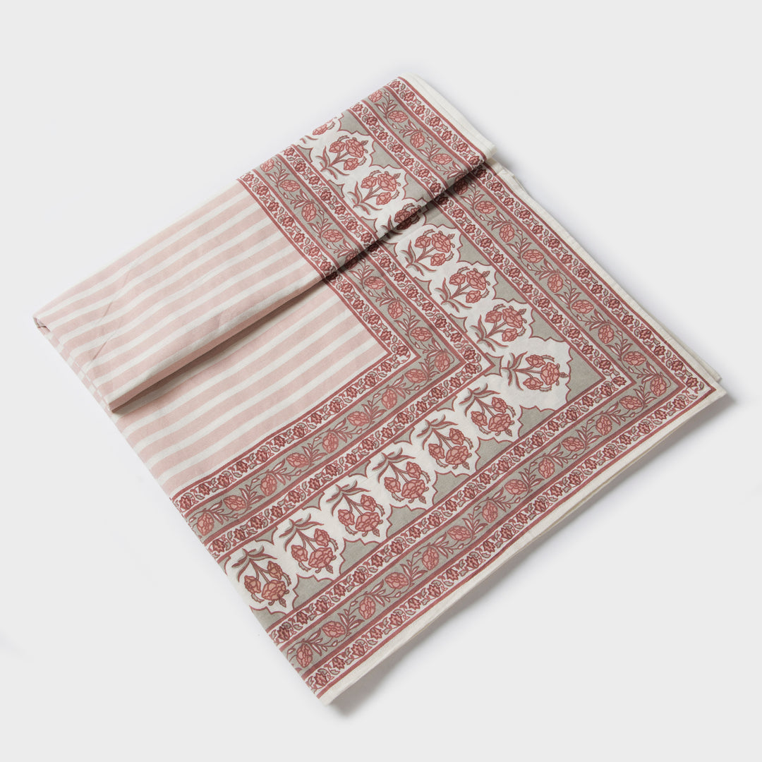 Gulshan tablecloth styled on dining table with plates, napkins, and décor

