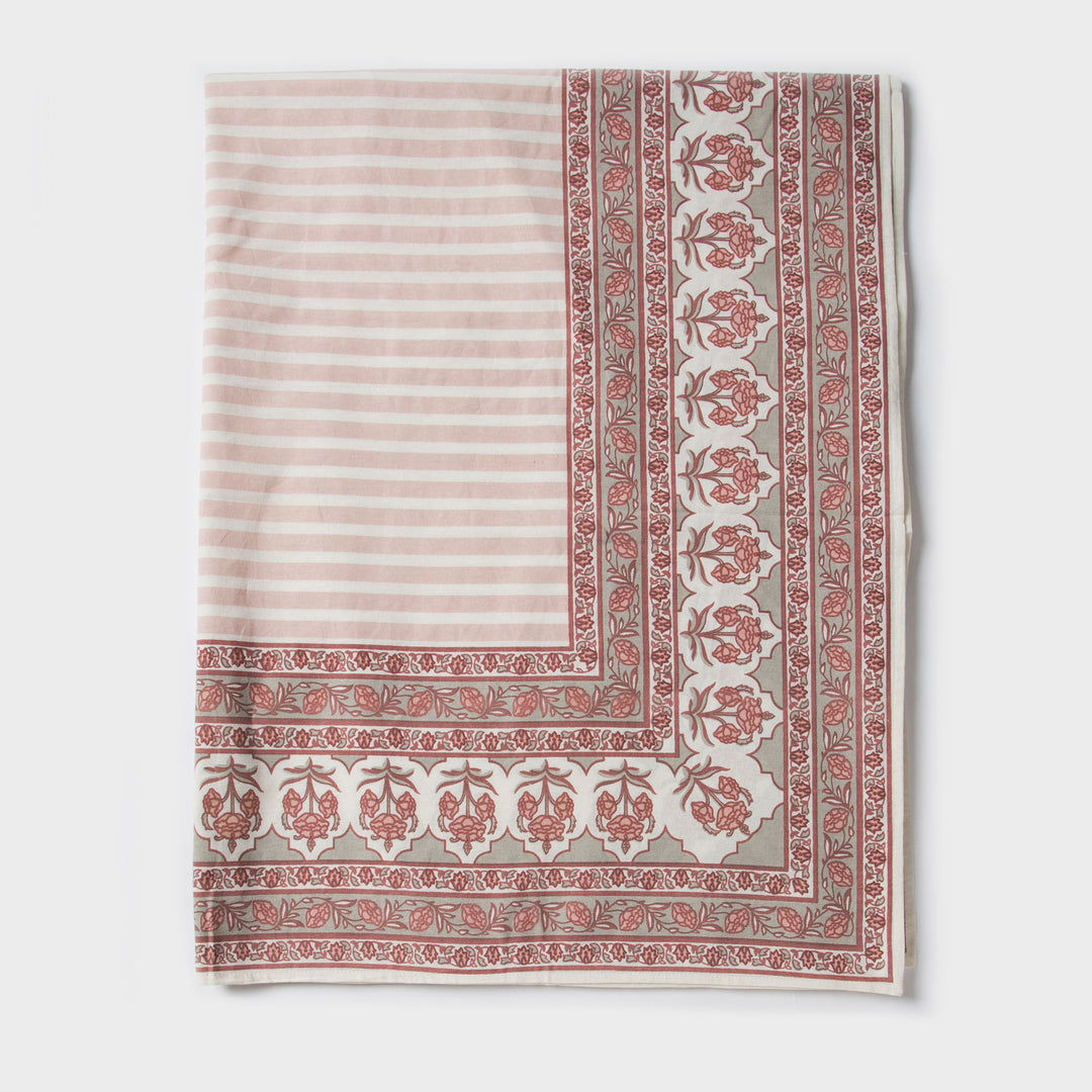 Gulshan tablecloth styled on dining table with plates, napkins, and décor
