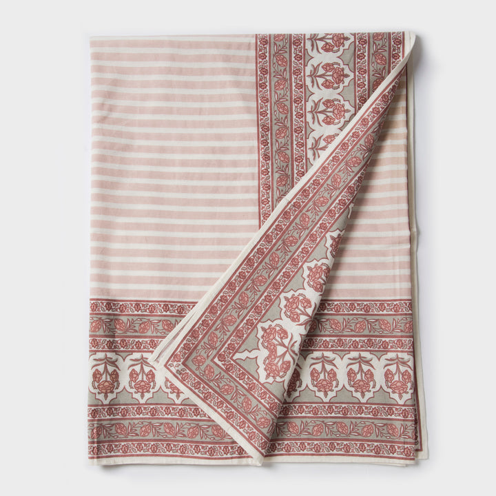 Gulshan tablecloth styled on dining table with plates, napkins, and décor
