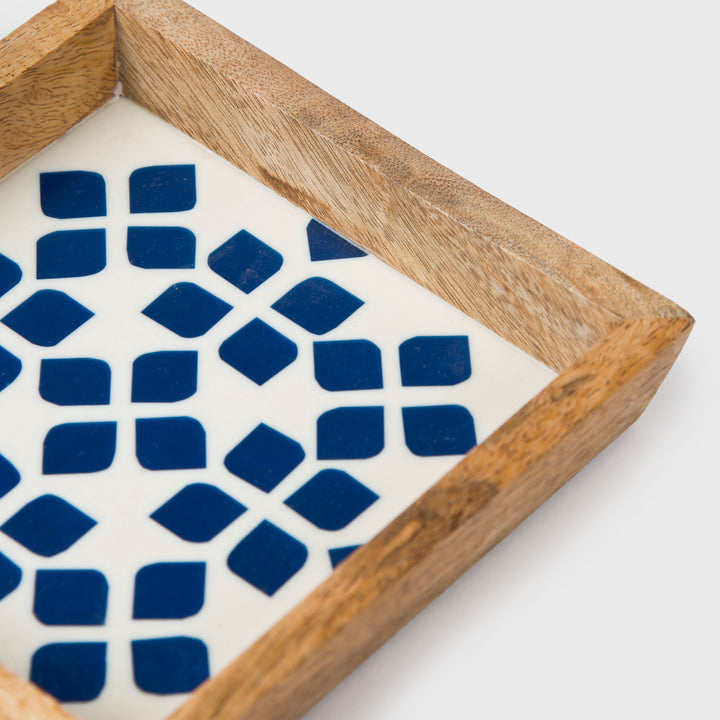 Close-up of blue lattice pattern and handcrafted finish on trinket bowl and tray