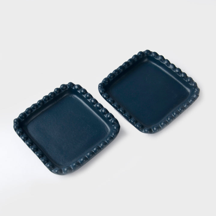  Close-up of beaded edge design and indigo finish on handcrafted terracotta tray