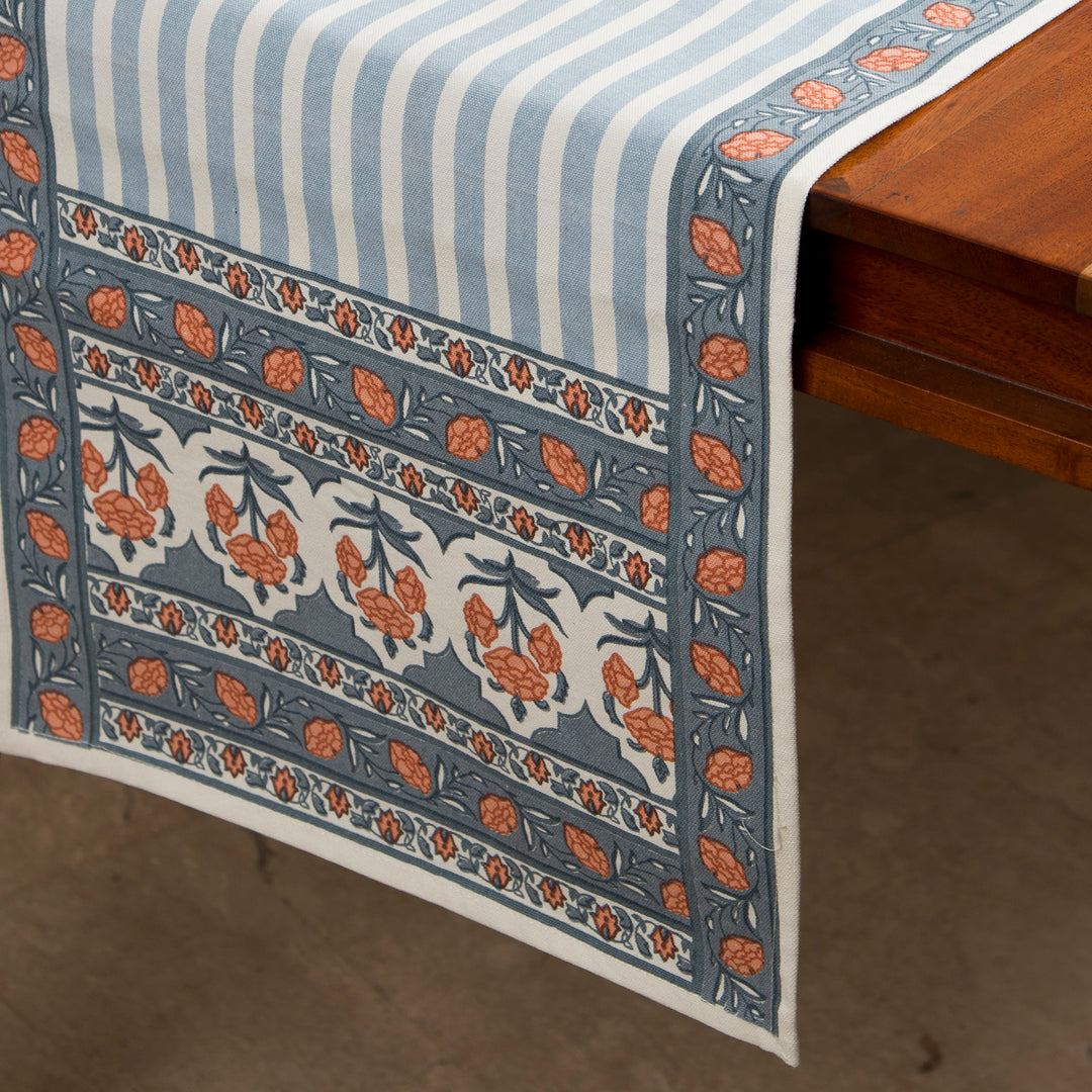 Printed cotton table runner in blue floral stripes
