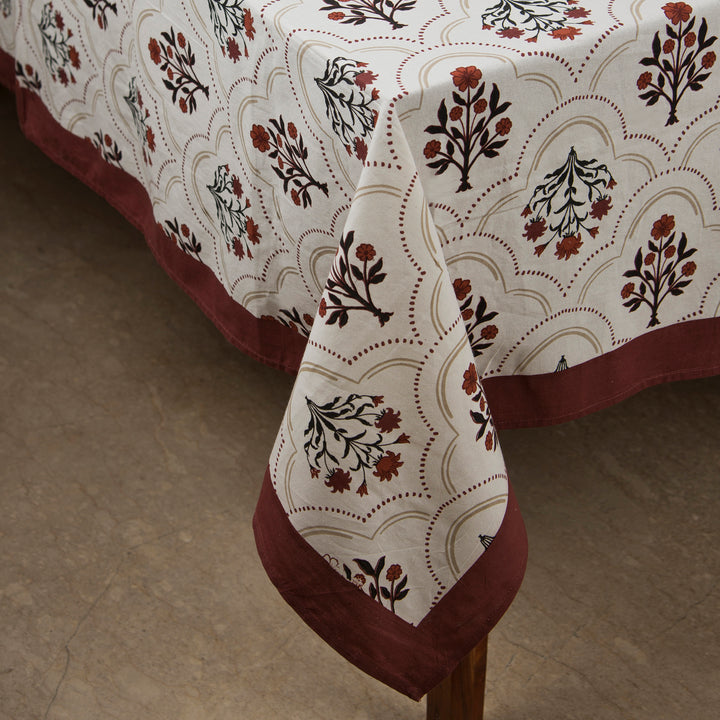 Gulnaar tablecloth styled with plates and table décor for a dining setup
