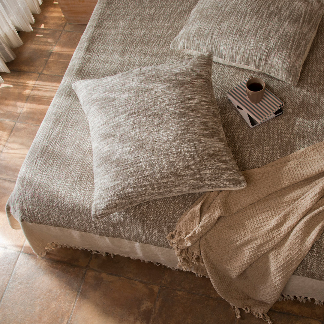 Earthy Brown cotton bed cover styled on bedroom setting with pillows and décor