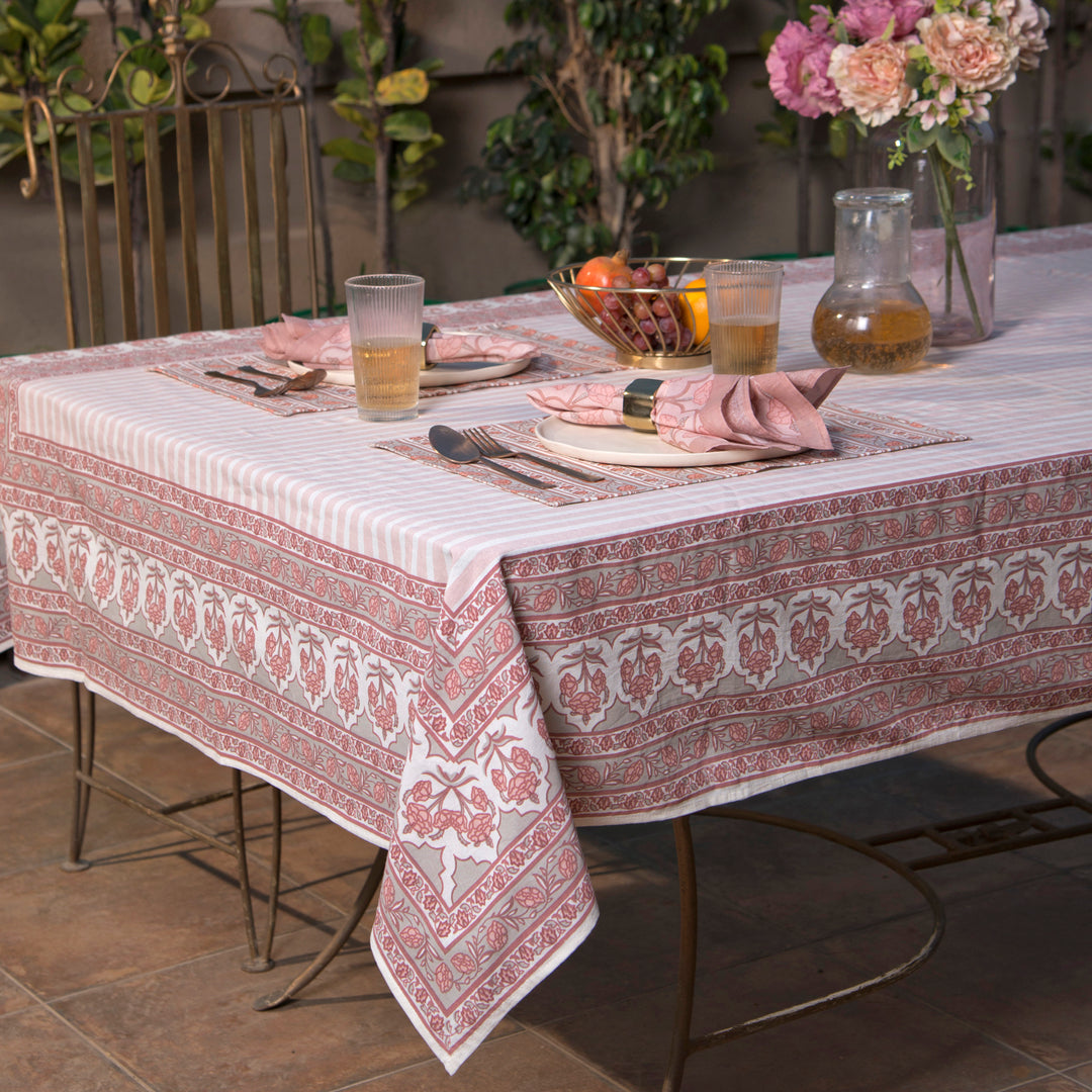 Gulshan tablecloth styled on dining table with plates, napkins, and décor
