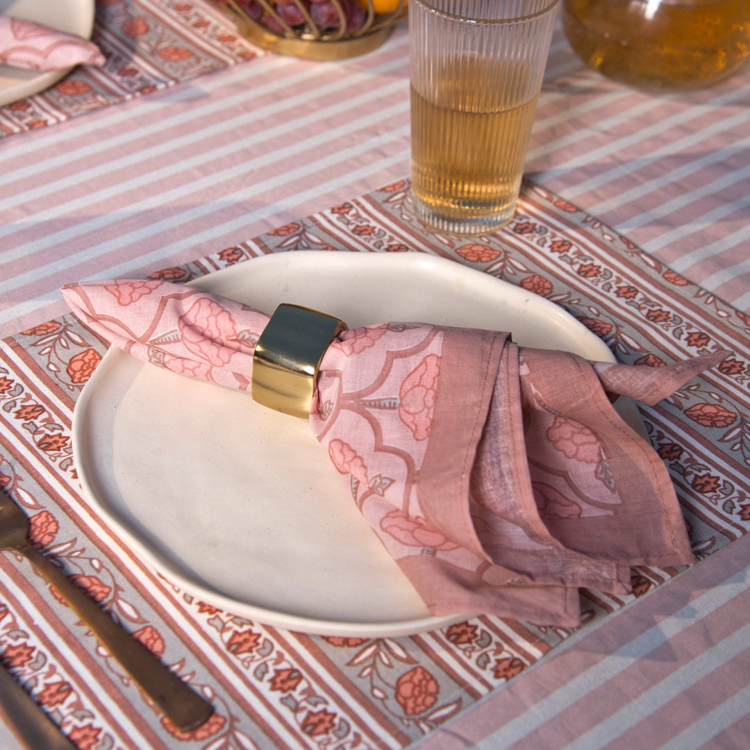 Gulshan tablecloth styled with plates and table décor for a dining setup