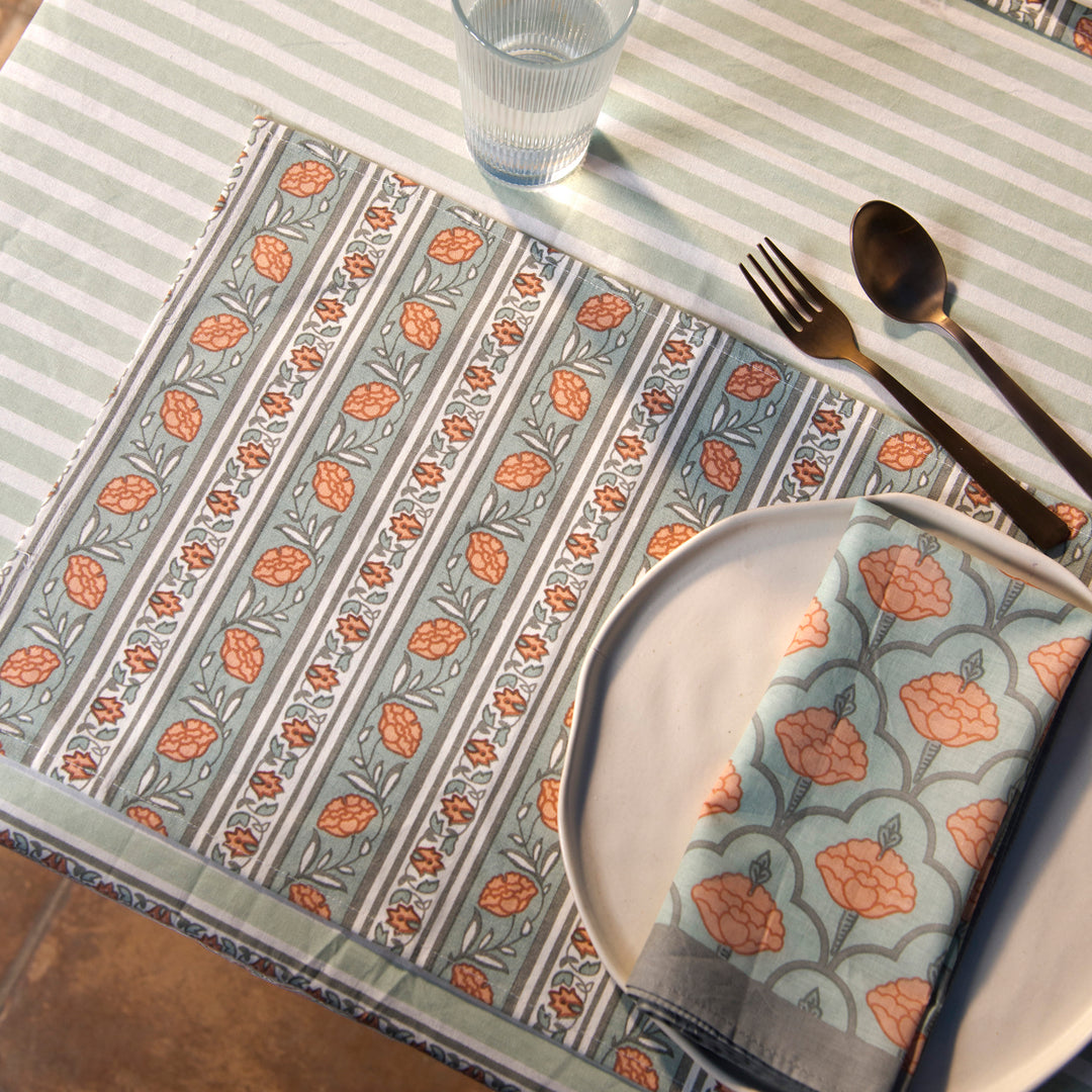 Gulshan table mats styled on dining table with plates and table décor
