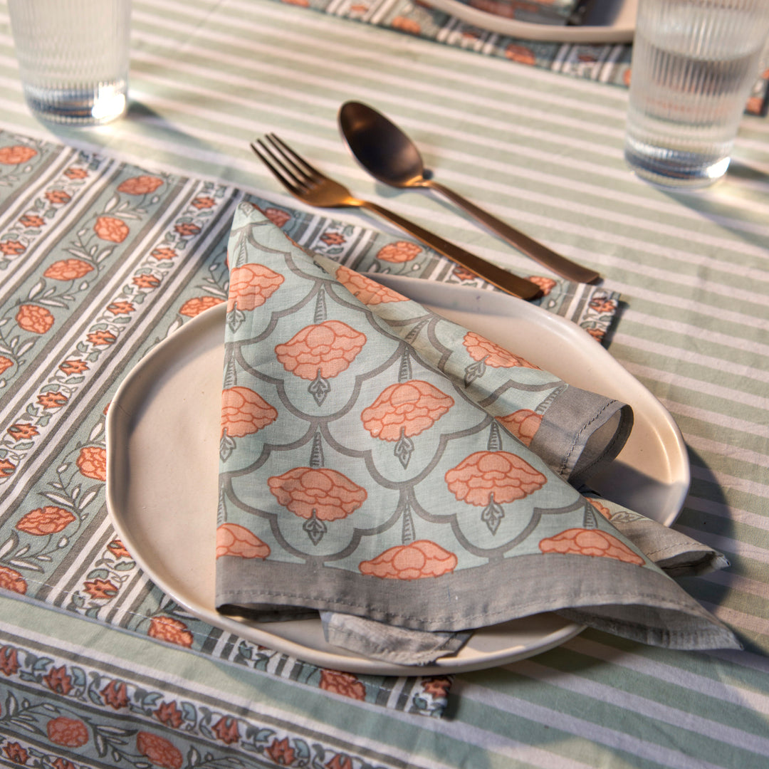 Gulshan tablecloth styled with plates and table décor for a dining setup

