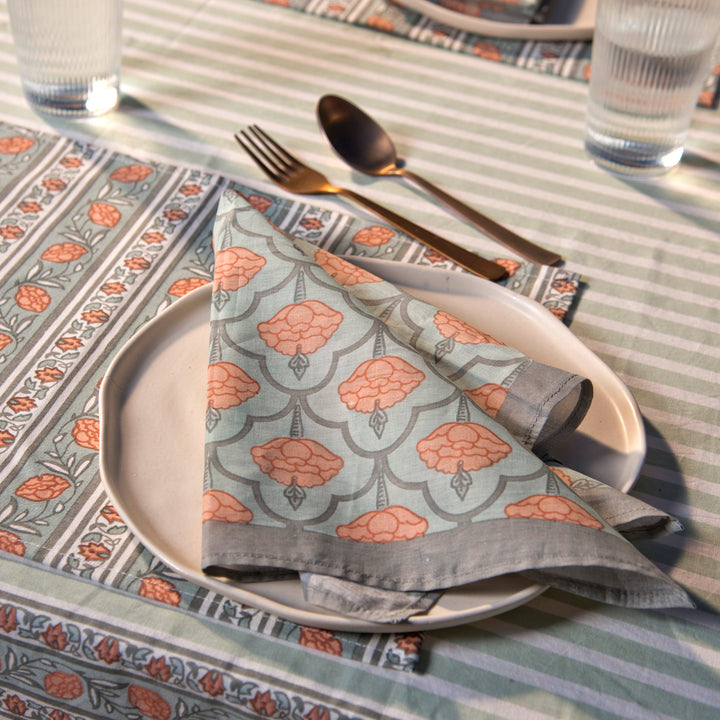 Gulshan tablecloth styled with plates and table décor for a dining setup
