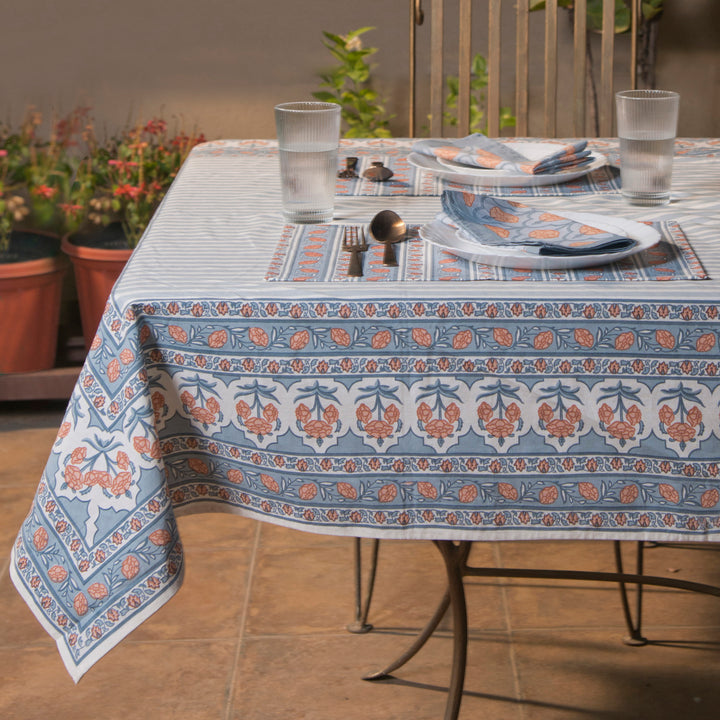 Gulshan tablecloth styled on dining table with plates, napkins, and décor
