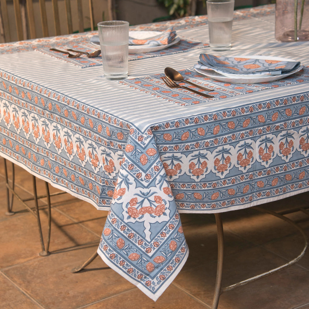 Gulshan tablecloth styled on dining table with plates, napkins, and décor
