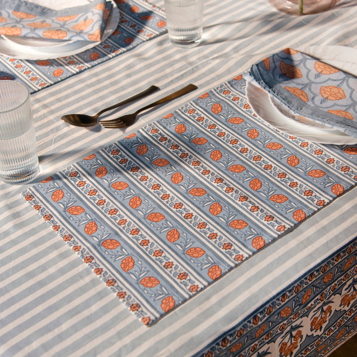 Gulshan table mats styled on dining table with plates and table décor
