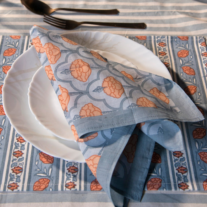 Gulshan tablecloth styled with plates and table décor for a dining setup
