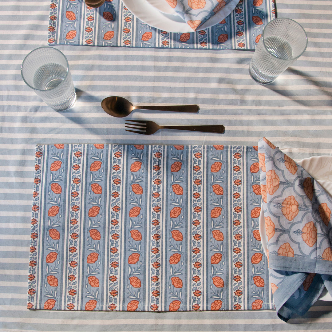 Gulshan table mats styled on dining table with plates and table décor

