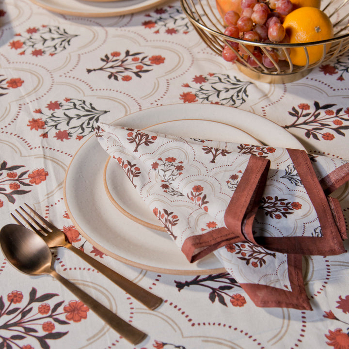 Gulnaar tablecloth styled with plates and table décor for a dining setup