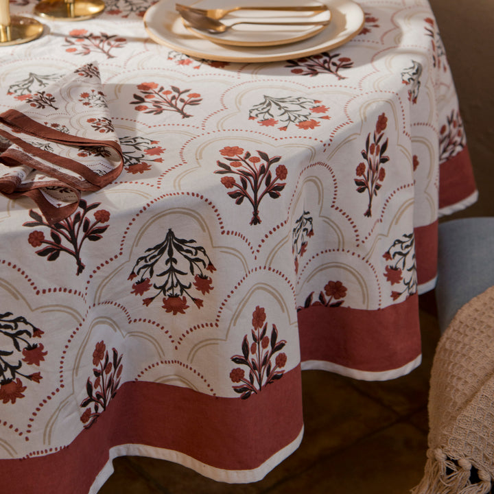 Gulnaar tablecloth styled with plates and table décor for a dining setup
