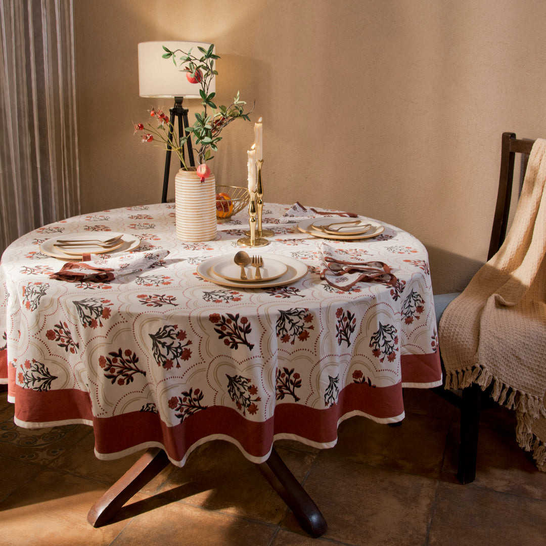 Gulnaar tablecloth styled with plates and table décor for a dining setup
