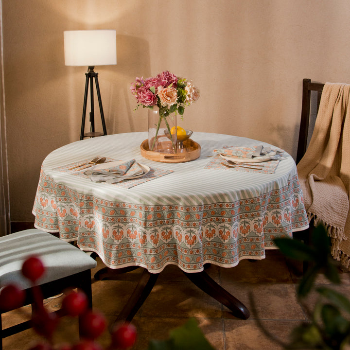 Gulshan tablecloth styled on dining table with plates, napkins, and décor
