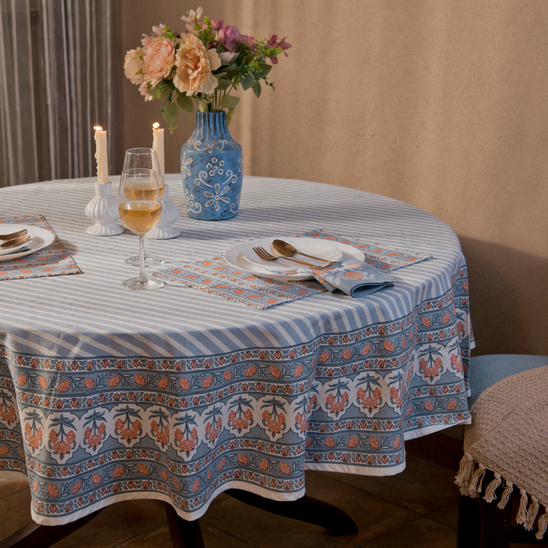 Gulshan tablecloth styled on dining table with plates, napkins, and décor
