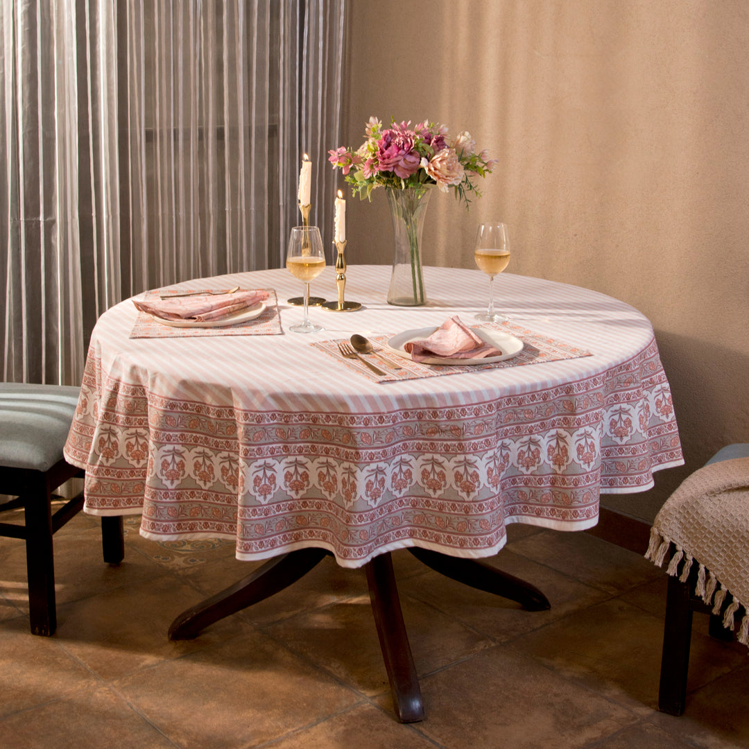 Gulshan tablecloth styled on dining table with plates, napkins, and décor
