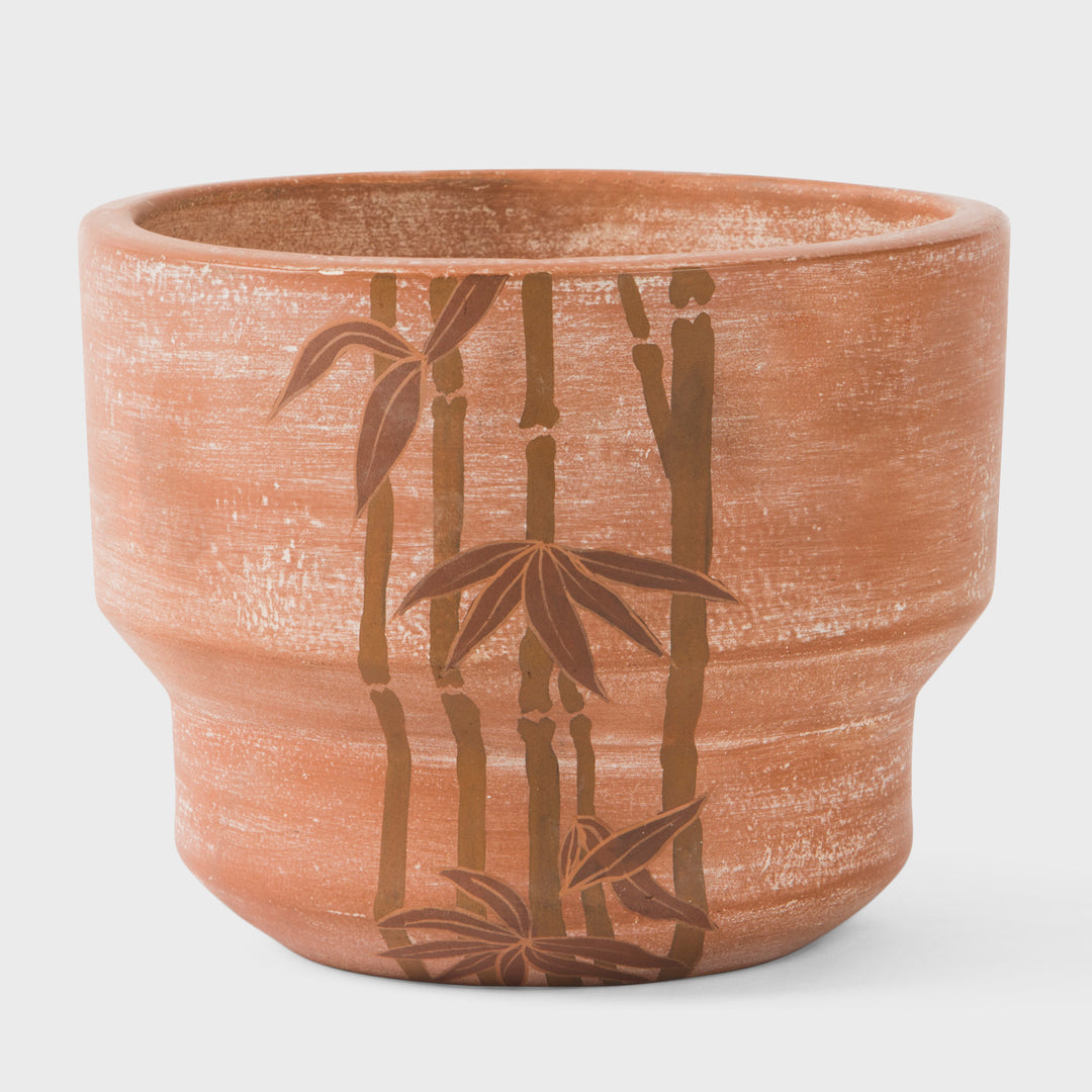 Hand painted bamboo grove terracotta 7 diameter planter with ochre and white leaves on a natural clay background  