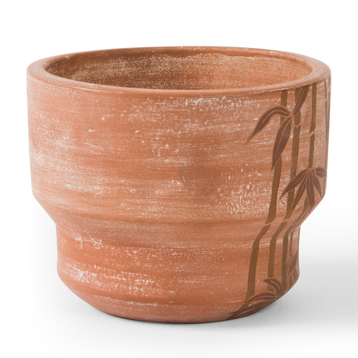 Hand painted bamboo grove terracotta 7 diameter planter with ochre and white leaves on a natural clay background  