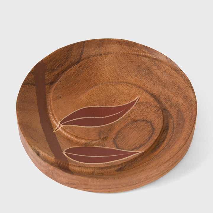 Handcrafted matte indigo round mango wood wall mirror with a hand-carved beaded frame by Mela Artisans.